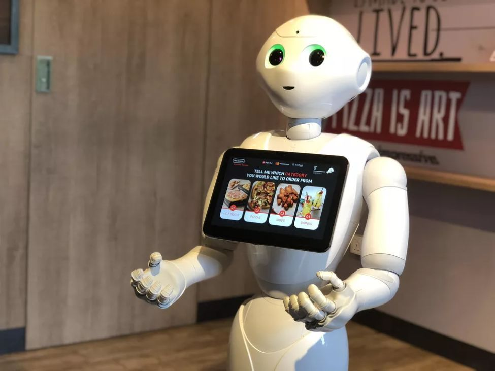 O uso de máquina automática em uma loja de café da manhã civil